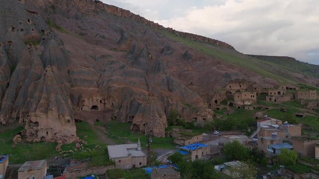 aerial drone of the ancient hand-carved Selime Cathedral rock monastery. Spectacular historic troglodyte architecture and volcanic mountain landscape in Cappadocia, Turkey