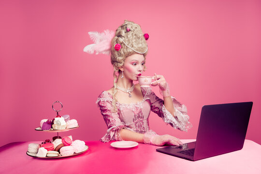Photo of happy attractive lady dressed baroque costume enjoy tea time chatting device isolated pink color background