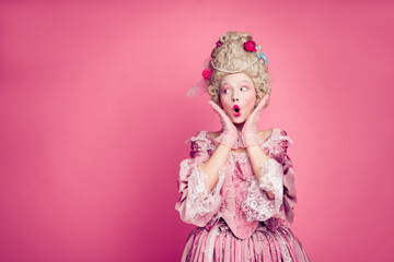Fototapeta premium Photo of shocked surprised lady princess look empty space wearing antique style dress costume isolated pink color background