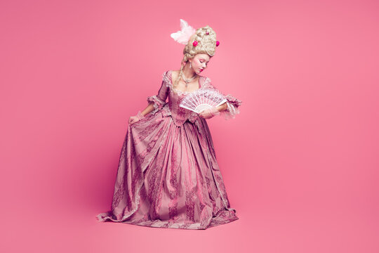 Full length photo of adorable lovely marie antoinette wear corset dress doing curtsey empty space isolated pink color background
