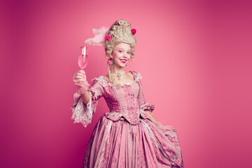 Fototapeta premium Photo of adorable lovely marie antoinette wear corset dress drinking wine empty space isolated pink color background
