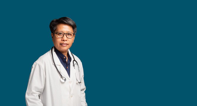 Confident Female Doctor in White Coat on Teal Background