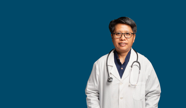 Female Doctor Standing with Stethoscope on Teal Background
