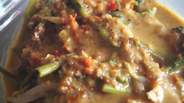 Close Up View of Indonesian Pecel or Lotek Mixed Boiled Vegetables with Peanut Sauce