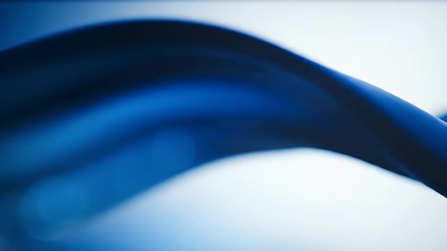 Abstract flowing blue curves and soft gradients on a light background