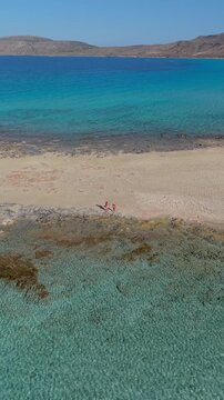 Experience the tranquil shores of Simos Beach, where crystal-clear waters meet golden sands. Enjoy a beautiful summer day on Elafonisos Island Greece, perfect for relaxation and exploration.