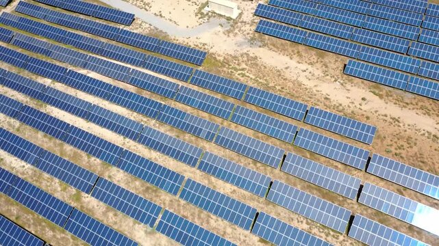 Aerial view flying over solar panel farm