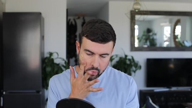 Handsome Man Applying Bronzer Foundation 
