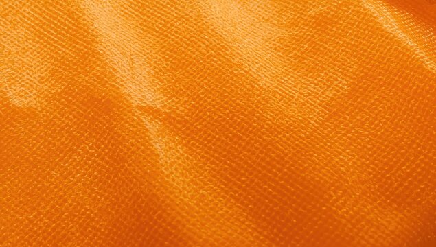 Close-up of orange tarpaulin texture. Background, wallpaper, template.