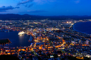 Fototapeta premium Night view of Hakodate from Mount Hakodate, one of Japan's three famous night views, Hokkaido, Japan. Spectacular night view of Hakodate city seen from Mount Hakodate in Hokkaido, Japan. 