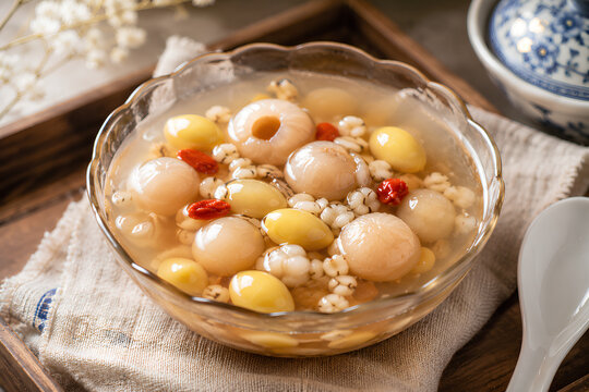Traditional Cheng Tng dessert with sweet clear soup, ginkgo, longan, and barley, served as a refreshing Chinese dessert.