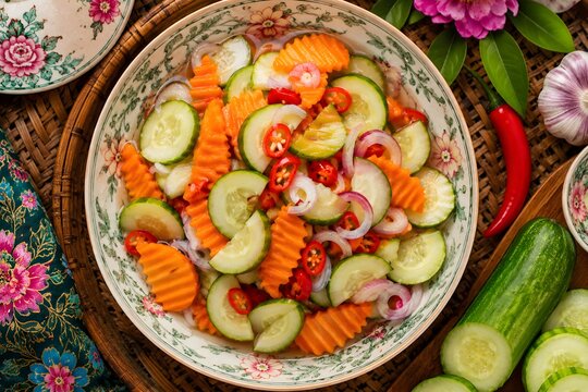 Traditional Acar Timun and Carrot with cucumber and carrot pickles in a tangy vinegar dressing, served as a refreshing side dish.