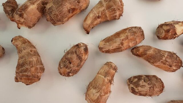 Taro on white table. Colocasia esculenta.