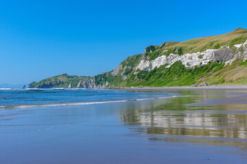 Obraz premium Scenic coastline and sea cliffs of Itanki Beach in Muroran, Hokkaido, Japan. Itanki Beach in Muroran, Hokkaido, Japan, known for its singing sand and dramatic coastal cliffs. A beautiful seaside lands