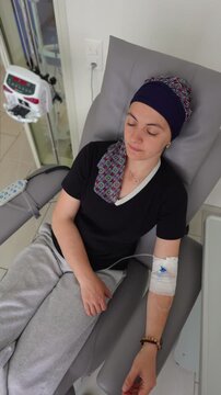 Cancer patient seated in treatment chair during infusion session highlighting perseverance resilience and hope throughout medical recovery process