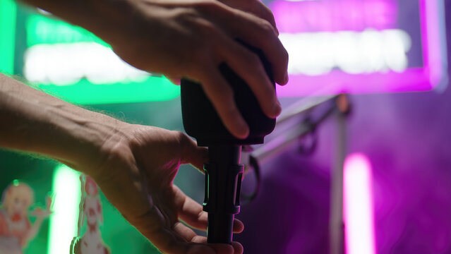 Setting up podcast set with microphone on table arm