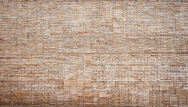 empty background of wide cream brick wall texture beige old brown brick wall concrete or stone textured wallpaper limestone abstract flooring grid uneven interior rock home decor design backdrop
