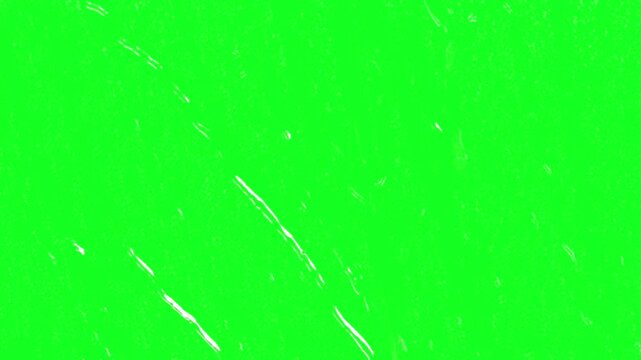 Condensation drops on window green screen chroma key background overlay with stormy autumn rain falling down for advanced multi layer film editing software compositing video layouts.........