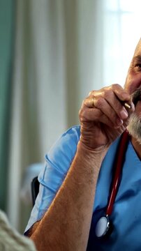 Indian male doctor consulting male patient during routine medical discussion as experienced physician advises young man inside modern Indian clinic OPD healthcare consultation