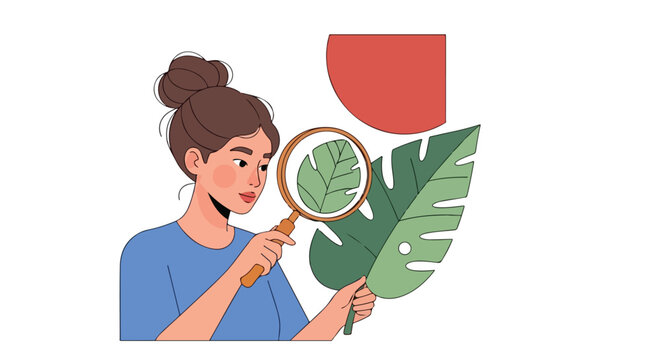 Woman observing a leaf with a magnifying glass