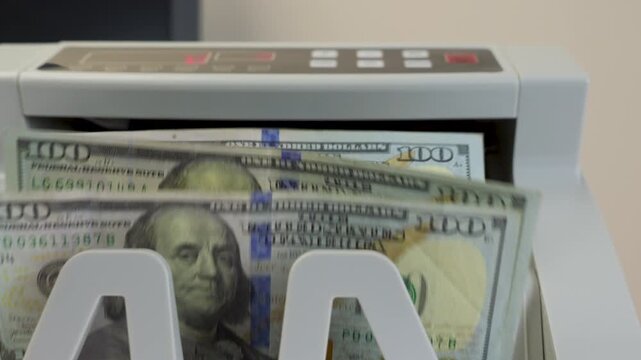 Money Counting Machine with Digital Display Processing US 100 Dollar Bills, jib studio shot