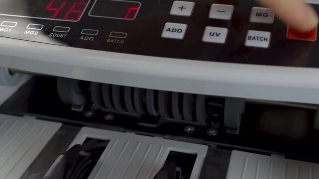 Money counting machine processing US 100 Dollar bills,
jib studio shot