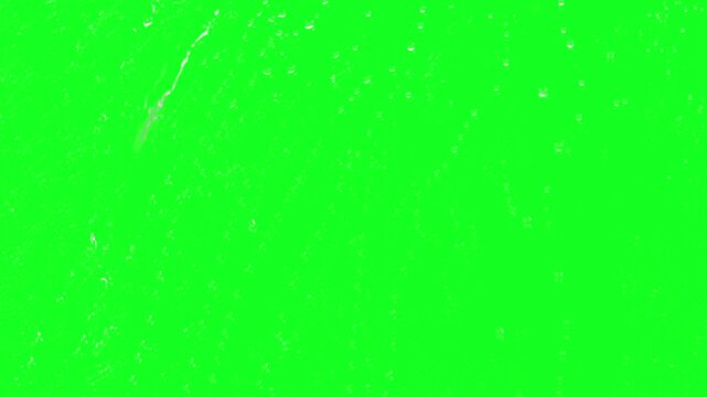 Condensation drops on window green screen chroma key background overlay with stormy autumn rain falling down for advanced multi layer film editing software compositing video layouts.........