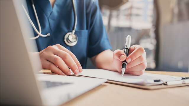 Medical doctor completing administrative healthcare records