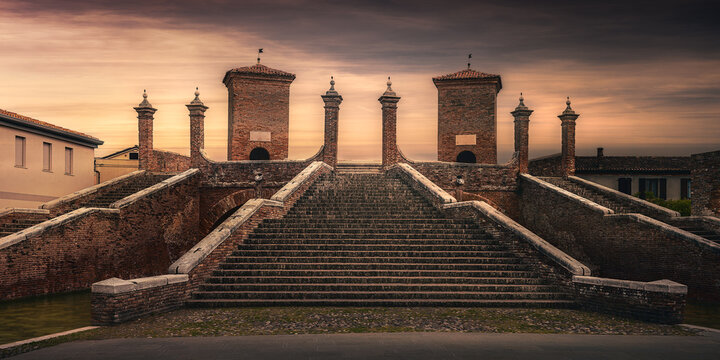 Famous Trepponti bridge at sunset in Comacchio, Emilia-Romagna, Italy