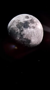 full moon on black space night background with futuristic lens flares. vertical video