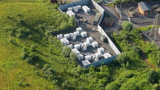 Modular BESS Battery Energy Storage System Storing Renewable Power. Grid management, AI energy optimization, and sustainable infrastructure. UK. 4K.
