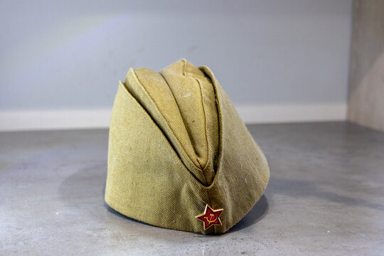 A Soviet military garrison cap with a red star pin.