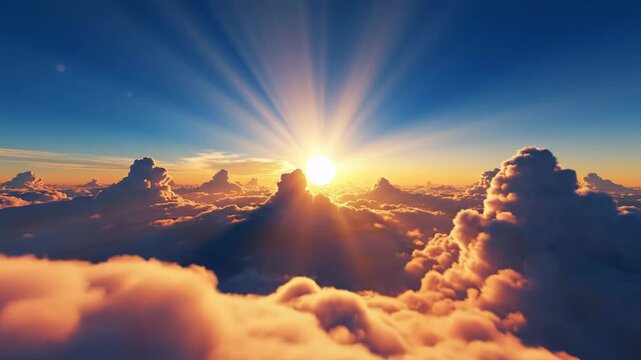 Aerial view of a beautiful sunrise above the clouds with sun rays shining through the sky
