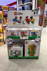 Naklejka premium Dubai, UAE - 24 may 2026: LEGO football themed construction sets featuring famous players and FIFA World Cup display arranged inside toy store, highlighting sports merchandise and retail promotion