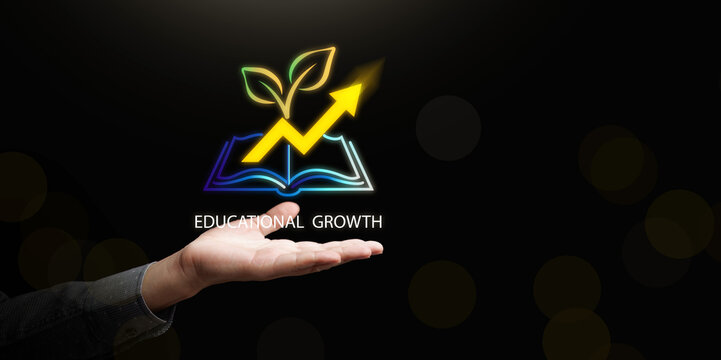 Open hand with digital icon of book with rising arrow and growing leaves on dark copy space. Educational growth, self improvement, continuous learning success, upskilling, and knowledge development.