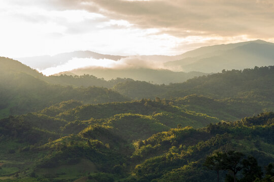 Blue golden sky sunrise dramatic beautiful landscape mountain. Dramatic sunset over mountain landscape. Beautiful landscape foggy hills twilight time. Dawn sky gold dusk time cloudscape with sunlight