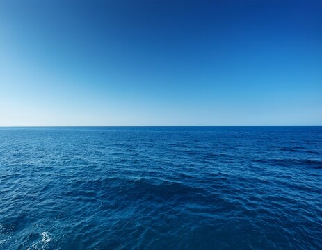 vast blue ocean and a cloudless sky with room for text