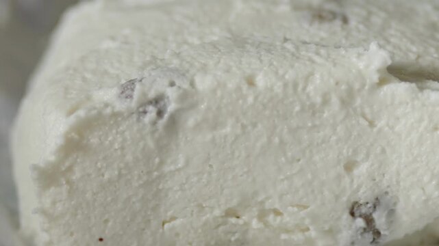 Macro shot of sweet cottage cheese mass with raisins wrapper