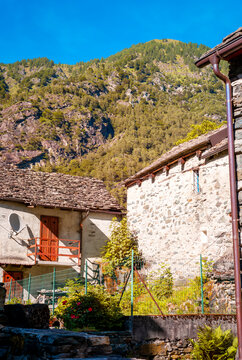 View of the village and the typical houses of the village of Rovesca, located in the Ossola mountains (an Alpine valley in Piedmont, Northern Italy, bordering Switzerland).