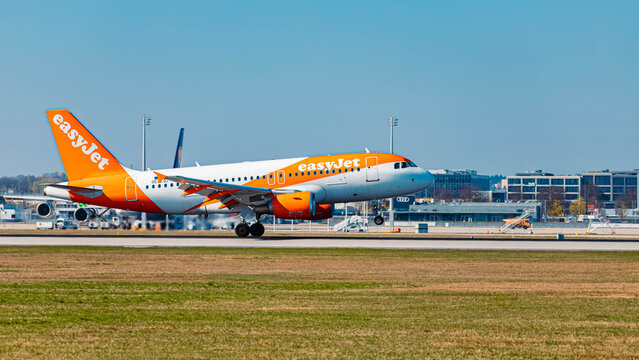 OE-LQZ easyJet Europe Airbus A319 passenger jet airplane touchdown on a sunny spring day at Munich airport, MUC, Freising, Bavaria, Germany