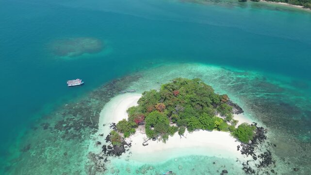 Aerial Orbit Of Idyllic Tropical Island With Beach And Coral Reef