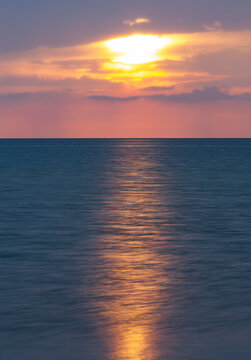 Golden Sunset Over The Calm Ocean