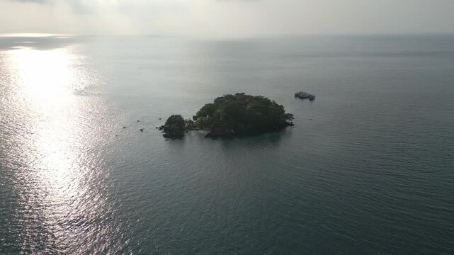 Tranquil Aerial Over Lush Green Islet And Glittering Sea Lampung