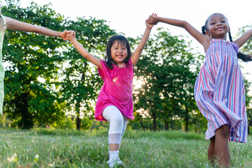 Obraz premium Joyful children playing outdoors together