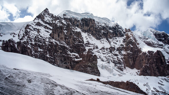 Snow-capped summits and glaciers of the Carabaya mountain range in the Peruvian Andes.