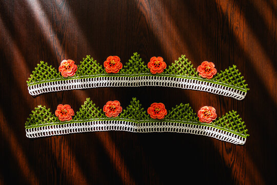 Hand-crocheted lace on the background. Handmade lace used in dowries and decorative embellishments.