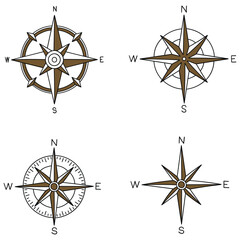 Obraz premium Hand-drawn cartoon set of wind rose compass symbols on a white background.