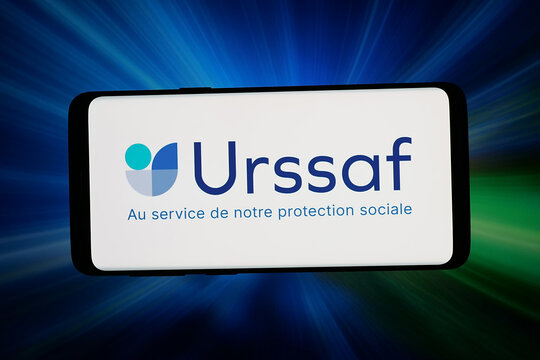 Stuttgart, Germany - 06-11-2026: In this photo illustration, the logo of French social security authority Urssaf is displayed on a smartphone in front of abstract background on computer screen.
