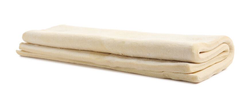 Raw puff pastry dough isolated on white