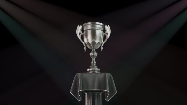 Trophy cup silver award marking a second place runner-up zooming in a CG animation against dark spotlights. Esports tournament finals, corporate recognition, sports competition awards.